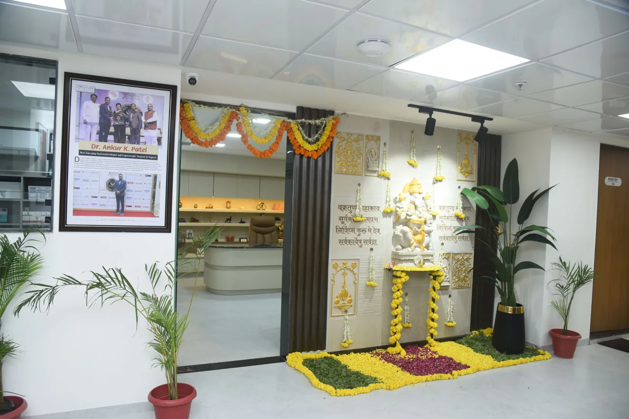 Decorated hospital entrance with plants and a view into the consultation room